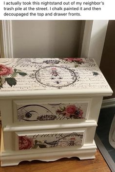 a white chest with flowers painted on it