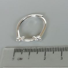 A free size sterling silver ring with knots. SIZE: 1.6 mm x 20 mm as sold ( It can slide wide or narrow and can be adjusted to fit most fingers) WEIGHT: 2.17 gm This ring is made of 925 hypoallergenic sterling silver. Most of my pieces come with a 925 stamp. Can be packaged in a gift box. I can include a personal message from you if needed You are welcome to contact me at... bhavnakwintra1956@gmail.com For more beautiful pieces from my shop, please browse 👇 TOE RINGS: https://www.etsy.com/your/ Hypoallergenic Sterling Silver Toe Rings In Silver, Hypoallergenic Silver Sterling Toe Rings, Sterling Silver Hoop Ring For Gift, Elegant Sterling Silver Hypoallergenic Toe Rings, Hypoallergenic Sterling Silver Open Ring Jewelry, Elegant Hypoallergenic Sterling Silver Toe Rings, Hypoallergenic White Gold Sterling Silver Midi Rings, Hypoallergenic Sterling Silver Open Ring, Silver Hoop Rings For Gifts