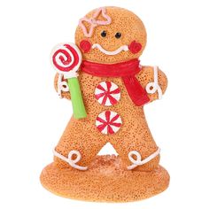 a ginger holding a candy cane and wearing a scarf