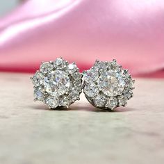 This stunning pair of earrings features a floral design formed by clusters of old European cut diamonds. The center diamonds are GIA-certified as 0.63ct, I color, VVS2 clarity and 0.65ct, I color, SI1 clarity. The total diamond weight of each earring is approx. 1.33ct. These earrings are handcrafted in platinum. ✦ DIAMOND SPECIFICATIONS:    Center Diamond Weight: 0.63 Carats, 0.65 Carats  Center Diamond Color: I Color  Center Diamond Clarity: VVS2, SI1  Center Diamond Cut: Old European Cut  Cert Platinum Cluster Diamond Earrings For Formal Occasions, Dazzling Cluster Diamond Earrings For Formal Occasions, Dazzling Cluster Diamond Earrings For Formal Events, Gia Certified Cluster Earrings For Formal Occasions, Formal White Gold Cluster Earrings, Luxury Diamond Cluster Earrings In Flower Shape, Luxury Brilliant Cut Cluster Earrings For Anniversary, Classic Platinum Rose Cut Diamond Earrings, Classic Platinum Earrings With Rose Cut Diamonds