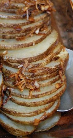 sliced up potatoes sitting on top of a metal plate