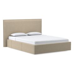 the headboard and foot board of a bed with white sheets on top of it