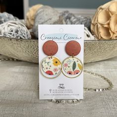 These stylish and lightweight stud earrings feature double-sided floral print faux leather and hand mixed shimmering copper colored clay. Clay is custom mixed, shaped, baked and sanded before assembly. Faux and vegan leather has turquoise finish on the back side. Each unique earring is carefully and meticulously crafted by hand, therefore no two pair are identical. This design is limited edition, with only two pair in existence. Earring drop length is approximately 1.5" with a width of  1". Hypo Colored Clay, Unique Earring, Clay Clay, Sustainable Gifts, Fabric Gift Bags, Earrings Drop, Floral Earrings, Fabric Gifts, Copper Color