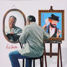 a man sitting on a stool in front of a painting with an image of a clown