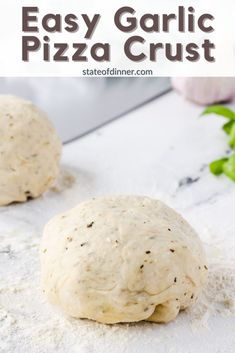 two pizza crusts sitting on top of a white counter next to each other with text overlay that reads easy garlic pizza crust