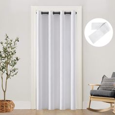 a living room with white curtains and a rocking chair