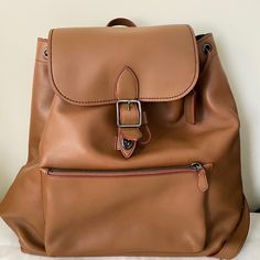 It's New And Not Used. Material Leather Color Light Brown Size H35w35d10(Cm) Luxury Satchel Backpack For Errands, Luxury Backpack With Removable Pouch For Errands, Designer Everyday Backpack With Removable Pouch, Designer Leather Backpack With Removable Pouch For Travel, Designer Leather Backpack With Removable Pouch, Classic Coach Backpack With Adjustable Strap, Designer Satchel Backpack For On-the-go, Designer Leather Backpack With Adjustable Strap For Daily Use, Designer Leather Backpack For On-the-go