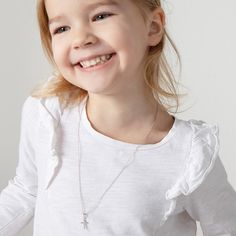 Looking for a timeless cross for an adorable little one? This understated yet elegant tiny cross necklace rests on its own matching chain, and is entirely crafted of sterling silver making it suitable for those with sensitive skin. This tiny cross comes neatly packaged in its own little gift box for your convenience. Age Group: Elegant for Babies, Infants, Young Girls & Preteens (0-12 years); Safe for Sensitive Skin Material: 925 Sterling Silver Cross Size: 9mm W x 12mm H polished plain cross Me Tiny Cross Necklace, Girls Necklace, Tiny Cross, Girls Necklaces, Sterling Silver Cross, Toddler Kids, Silver Cross, Infants, Little Gifts