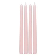 three pink candles sitting next to each other