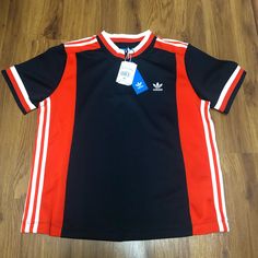 It’s Brand New. Please Send Me An Offer Orange Sporty Crew Neck Top, Adidas Navy Short Sleeve Tops, Adidas Navy Sporty Tops, Navy Adidas Sporty Top, Navy Sporty Adidas Tops, Sporty Navy Adidas Tops, Casual Navy Adidas Top, Sporty Orange Short Sleeve Tops, Adidas Multicolor Short Sleeve Tops