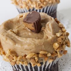 two cupcakes with peanut butter frosting on top