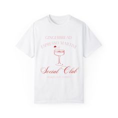 This Gingerbread Espresso Martini Social Club Christmas T-shirt exudes a cozy and festive vibe, perfect for holiday gatherings and celebrations. The relaxed fit and classic crew neckline make it a versatile piece for both casual and semi-formal settings. Ideal for those who love Christmas parties and unique holiday shirts. Product features - Available in sizes S to 4XL for the perfect fit - Double-needle stitching for durability - Garment-dyed fabric for a soft color and texture - Made with high-quality 100% US cotton - Available in 58 colors for a wide variety of options Care instructions - Machine wash: cold (max 30C or 90F) - Do not bleach - Tumble dry: low heat - Iron, steam or dry: low heat - Do not dryclean Holiday Party T-shirt With Short Sleeves, Relaxed Fit Short Sleeve T-shirt For Holiday, White Graphic Print Shirt For Holiday, Casual Winter Party T-shirt, Christmas Party T-shirt With Graphic Print, White Relaxed Fit Christmas T-shirt, Relaxed Fit Crew Neck T-shirt For Christmas, White Relaxed Fit T-shirt For Christmas, Holiday Party T-shirt With Crew Neck