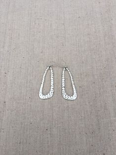 "How cool are these? Sleek mod geometric statement earrings, hang from simple silver ear wire hooks. Made from allergy free plated silver. They have a cool hammered texture which makes them even more unique. These earrings are lightweight and comfortable for everyday wear. They measure 1 5/8\" long by 5/8\" at the widest part. Overall drop length is about 1 3/4\". I can make a matching necklace, if you would like the whole set. Just send me a message and we will make it happen! Thanks for stoppi Trendy Nickel-free Linear Drop Earrings, Modern Hammered Earrings For Everyday, Geometric Metal Earrings For Everyday, Geometric Metal Earrings With Ear Wire, Minimalist Metal Teardrop Earrings For Pierced Ears, Minimalist Metal Teardrop Earrings, Modern Nickel-free Dangle Teardrop Earrings, Everyday Geometric Single Earring, Everyday Single Geometric Earring