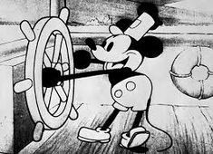 the mickey mouse cartoon is holding on to a wheel