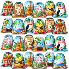 a bunch of bags that have different designs on them, including pineapples and flamingos