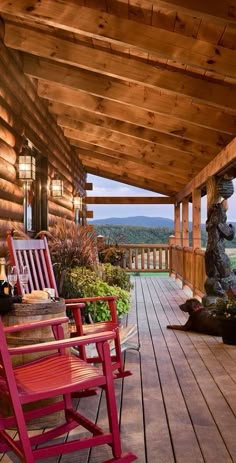 two rocking chairs on the front porch of a log cabin