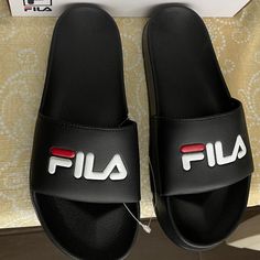 Sandals For Daily Use, Black With Their Brand Letters On The Front, New In Their Boxes. The Photograph Of The Measurement Is Of A Size 6 Black Summer Slides With Cushioned Footbed, Black Summer Flip Flops, Black Synthetic Slides For Summer, Black Flat Summer Flip Flops, Black Summer Style Flat Flip Flops, Black Summer Slip-on Slides, Synthetic Slide Flip Flops For Streetwear, Black Non-slip Sport Sandals For Streetwear, Fila Shoes For Men