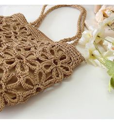 IN STOCK FAST SHIPPING FROM LOS ANGELES Artfully designed for your summertime getaways, the Elena Handbags Floral Design Straw Beach Tote adds a touch of charm and elegance to any beachwear ensemble. Crafted from lightweight straw and woven with intricate floral designs, this bag is the perfect companion for yoga, the market place, and, of course, the beach. Elegant and tasteful, this sophisticated tote is sure to turn heads. Size is approximately 28cm wide x 25cm tall (11in x 10in) Designer Sty Sand-colored Straw Bag For Summer Beach, Summer Woven Sand-colored Shoulder Bag, Beige Lightweight Crochet Bag For Beach Season, Lightweight Beige Crochet Bag For Beach Season, Lightweight Rectangular Shoulder Bag For Beach, Lightweight Rectangular Shoulder Beach Bag, Chic Lightweight Straw Beach Bag, Brown Summer Straw Bag For Beach, Lightweight Beige Straw Bag For Beach Season