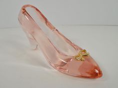 Pink Glass Gold Metal Rhinestone Crystal Front Bow Accent Cinderella Inspired Shoe Signed Cyndi Art Glass High Heel Slipper Shoe Figurine.  The Maker's Mark Signature is featured as seen in photo number seven 7. Measurements 4 inches in length 2 1/4 inches in height 1 3/8 inches in width Condition The Pink Glass Shoe is in good Vintage condition, no chips, cracks, breaks, repairs, etc....no noted damage, normal Vintage aging and wear, please see all photos for further detailed information. Thank you for stopping by my shop, visit a while and view my unique and eclectic inventory. Please favorite me as my inventory is constantly changing and growing....A TREASURE HUNT IN EVERY VISIT ! Allycatattic.etsy.com Please feel free to contact me with any questions, comments or additional photos. I w Glass Shoe, Glass Shoes, High Heel Slippers, Glass Slipper, Glass Art Sculpture, Maker's Mark, Slipper Shoes, Treasure Hunt, Pink Glass