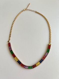 Rainbow multicoloured crystals necklace with high quality stainless steel gold plated chain. Multicolor Crystal Necklaces With Stones, Rainbow Chain Necklace As Gift, Rainbow Chain Necklace For Gift, Multicolor Gold-plated Necklaces For Parties, Multicolor Gold Plated Necklaces For Party, Multicolor Crystal Necklace With Jewels As Gift, Multicolor Clavicle Chain Necklace For Party, Multicolor Crystal Jewels Necklace As Gift, Multicolor Jeweled Crystal Necklace Gift