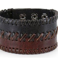 100% Leather Two Tone Color 2" Width Braided Center Adjustable Snap Closure Get A Bold Look In This Wide Two-Tone Leather Cuff From The Moonshine Spirit By Brad Paisley Collection. This Cuff Features A Braided Leather Center. The Soft Leather And Snap Closure Allows For A Comfortable Fit That Is Easy To Get On And Off. Casual Black Leather Bracelet, Brown Leather Bracelet With Black Band, Layered Cross Necklace, Brad Paisley, Black Wedding Rings, Vintage Dragon, Punk Vintage, Wood Bracelet, Skull Necklace