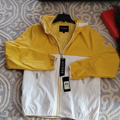 Bmwt! Guess Jacket In Yellow/ White Everyday Casual Outerwear Jacket. Features Hand Entry Pocket, Long Sleeve, Front Zip-Up Style With Your Favorite Pair Of Jeans, Denim Workout Pants, And Joggers. For Any Season Wear. Fast Ship White Weatherproof Fall Outerwear, White Waterproof Windbreaker For Fall, Casual White Weatherproof Outerwear, White Waterproof Outerwear For Streetwear, White Waterproof Outerwear For Casual Wear, White Weatherproof Windbreaker For Fall, Weatherproof White Windbreaker For Fall, Casual White Weatherproof Windbreaker, White Weatherproof Outerwear For Spring