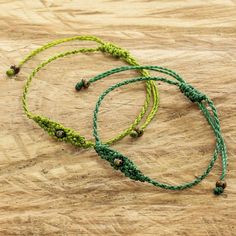 Carmina Giron in Guatemala employs macrame techniques, known as the "art of knots", to create this pretty pair of bracelets. The two bracelets are accented with metallic glass beads. Macrame Techniques, Hemp Macrame, Green Macrame, Beaded Macrame, Cotton Bracelet, Black Macrame, Buy Bead, Wristband Bracelet, Red Bracelets