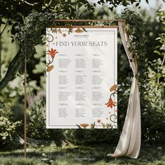 an outdoor seating sign with flowers and greenery