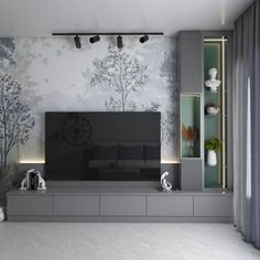 a living room with a large tv on top of a wooden entertainment center in front of a tree mural