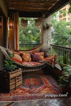 a hammock is on the porch with pillows