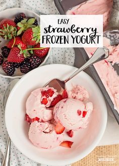 there is a bowl of ice cream with strawberries in it and the words strawberry frozen yogurt