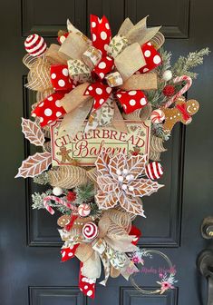 a red and white christmas wreath on the front door with candy canes, holly leaves and other holiday decorations