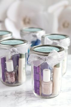 several jars filled with different types of nail polish