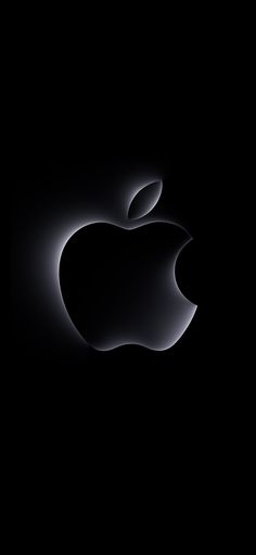 an apple logo is shown in the dark