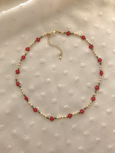 "This necklace features red poinsettias and holiday colors: cream, red, greens, and 24k gold plated seed beads. Length: 15\" inches Seed Bead Size: 11/0, 6/0 Adjustable: Each necklace has a 2.5\" gold filled lobster clasp extender Strung on: Non-Stretchy Beading Thread" Red Bead Necklace, Beaded Flower Necklace Tutorial, Cute Beaded Necklaces, Seed Bead Necklace Patterns, Seed Bead Flower Necklace, Bead Flower Necklace, Flower Bead Necklace, Seed Bead Ideas, Beaded Flower Necklace