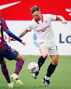 two men are playing soccer on the field