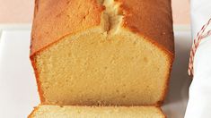 a loaf of pound cake sitting on top of a white plate next to a candy cane