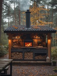 an outdoor wood burning oven in the woods