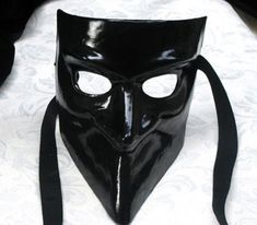 This masquerade mask for men belongs to our collection of historical masks: traditionally they were used in the past centuries in Venice. The name of this mask is Bauta and it was traditionally used by men. It is perfect for any masquerade party, Halloween costume, pro or event in Venice or elsewhere during Carnival. This mask can be gently bent to form to your face and ties in the back with two soft matching ribbons. Since the mask is handmade, your mask could be lightly different from the one Full Face Black Costume Mask, Black Full Face Masks For Costume, Black Full Face Masks For Costumes, Black Full Face Costume Mask, Black Venetian Masks And Prosthetics For Theater, Black Full Face Carnival Masks, Venetian Black Mask For Costume, Black Full Face Masks For Carnival, Bauta Mask