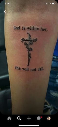 a cross with the words god is within her, she will not fall