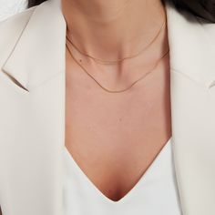 Double gold snake chain necklace. This necklace is a two layers set. The set has one short and one long snake chain. It is your go to every-day necklace. A perfect addition to your jewelry collection! ………………………………….D E T A I L S• Materials: Stainless steel, 18k gold plating.• Length: long chain: 15 inches (38 cm), short chain: 14 inches (35 cm) + extension 2 inches (5 cm)• This product is hypoallergenic, water and tarnish resistant Minimalist Curb Chain Necklace For Layering, Minimalist Snake Chain Layered Necklace, Double Snake Chain Necklace, Layering Snake Chain Necklace, Minimalist Double Chain Herringbone Necklace For Everyday, Double Chain Snake Necklace For Layering, Snake Chain Necklace With Double Chain For Layering, Gold Double Snake Chain Necklace, Gold Snake Chain Layered Necklace