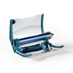 a roll of paper sitting on top of a blue holder