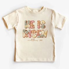 He Is Risen Jesus Easter Kids T-Shirt Family Matching Letter Print T-shirt For Spring, Personalized White Top For Spring, Pre-shrunk Family Matching Tops For Spring, Personalized Cotton T-shirt For Summer, Spring Unisex Custom Print T-shirt, Personalized Cotton Graphic Tee, Personalized Casual T-shirt For Spring, Spring Custom Print Unisex T-shirt, Easter Shirt Ideas