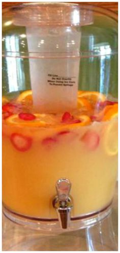 a close up of a fruity drink in a crock pot