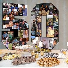 a table topped with lots of food next to a wall covered in pictures and candles