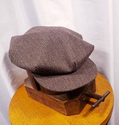 Although not vintage this beautiful Bespoke Newsboy Cap is just as vintage style you can get. Manufacturered by Simons made in U.S.A. a true treasure and I would be hard to beat, great fabic, great authentic look, real soft leather sweatband. Please view photos Condition: Custom made never worn you will not be disappointed super nice quality no defects. All questions welcomed. Buyer pays all related Priority shipping cost and insurance. All Sales Final Thank you CityVintage Vintage Wool Cap, Vintage Flat Bill Hat For Fall, Vintage Wool Flat Cap, Vintage Brown Flat Cap, Fitted Vintage Cap, Vintage Flat Cap For Winter, Vintage Cap For Fall, Vintage Fall Hats, Lake Elsinore