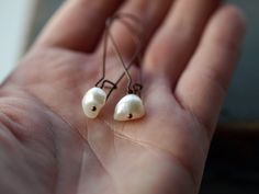 Usher in a new season with these lovely pearl earrings, perfect for year-round wear. White freshwater potato pearls with a luminous nacre and an off-round, organic shape hang from antiqued copper ear wires. Total length of the earrings is 1 3/4 inches from the curve of the ear wire to the bottom of the drop. The natural pearls measure approximately 8-10mm across. { the earrings pictured are a sample. you can expect some slight natural variation in your pearls. } Adjustable Pearl Charm Earrings As Gift, Freshwater Pearl Earrings, Pearl Dangle Earrings, June Birthstone Jewelry, Necklace Chain Lengths, Freshwater Pearls Earrings, June Birthstone, White Freshwater Pearl, Pearl Earrings Dangle