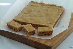 peanut butter bars are sitting on a cutting board