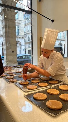 a chef is making cookies in the kitchen