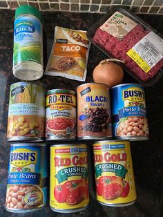 canned foods are arranged on a counter top